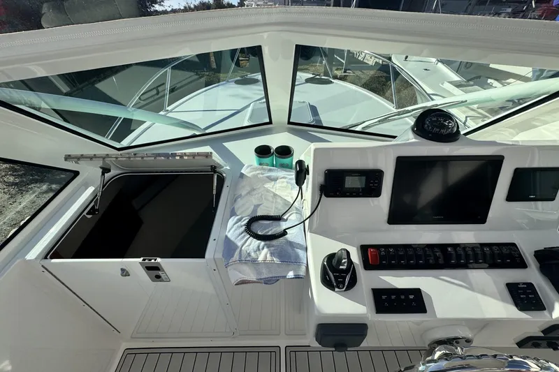 Slide: The Image of Aerial view of 2022 Albemarle 25 Express boat on calm water. - 6