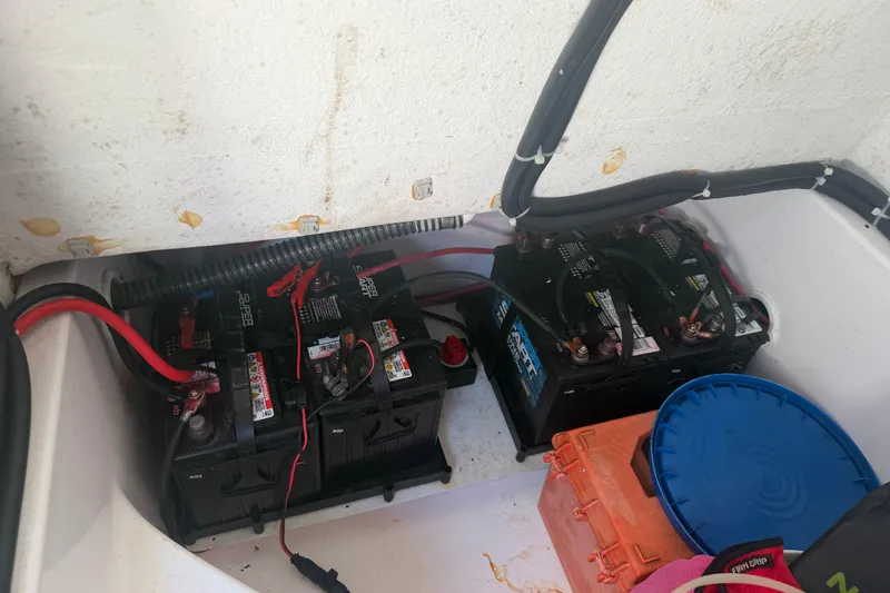 Slide: The Image of Batteries and storage compartment in 2024 Clearwater 2800 boat. - 24
