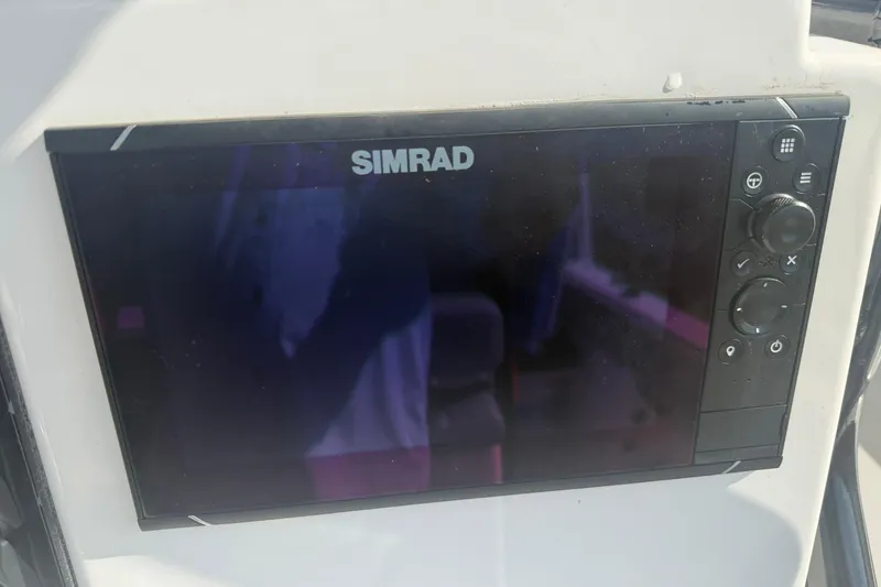 Slide: The Image of Simrad display on 2024 Clearwater 2800 boat dashboard. - 37