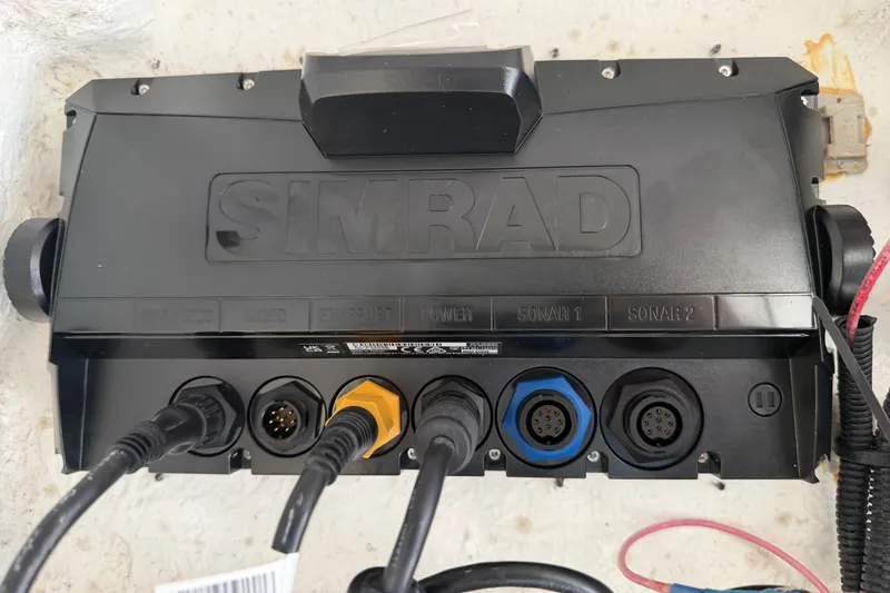 Slide: The Image of Simrad marine electronics system on a 2024 Clearwater 2800 boat. - 54