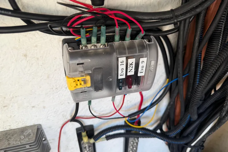 Slide: The Image of Electrical wiring setup in a 2024 Clearwater 2800, featuring labeled connections and fuses. - 56