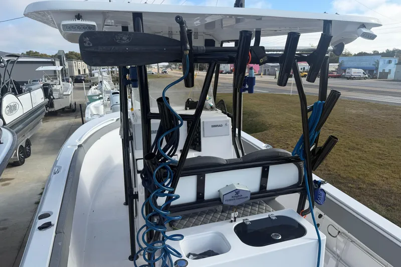 Slide: The Image of 2024 Clearwater 2800 boat with fishing rod holders and equipment on deck. - 6