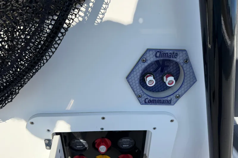 Slide: The Image of 2024 Clearwater 2800 boat climate control panel with command switches. - 67