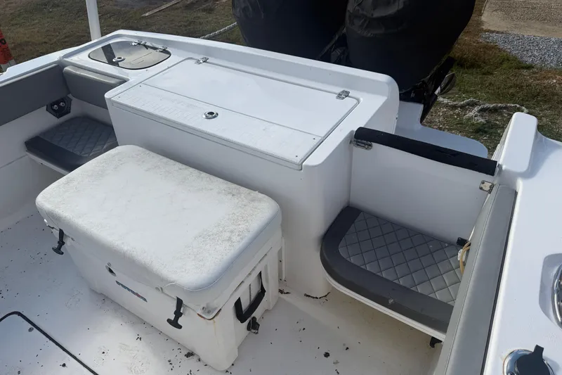 Slide: The Image of 2024 Clearwater 2800 boat interior with seating and storage compartments. - 10