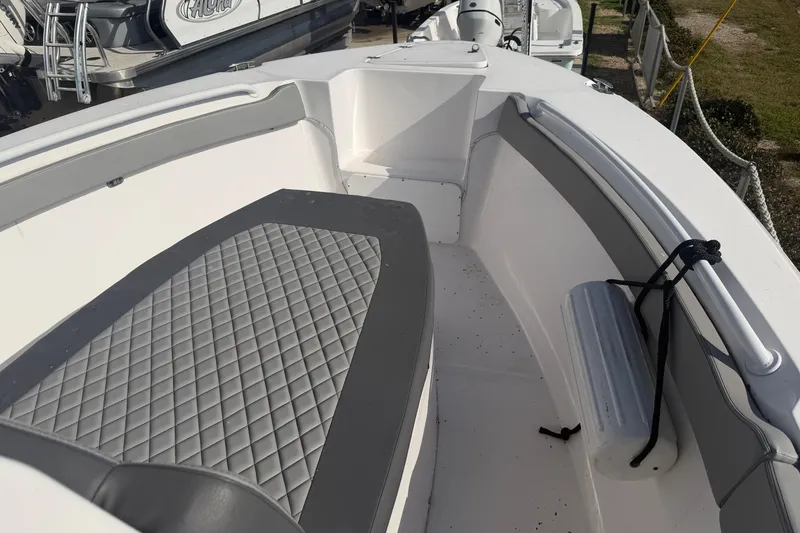 Slide: The Image of 2024 Clearwater 2800 boat interior with quilted seating and sleek design. - 16