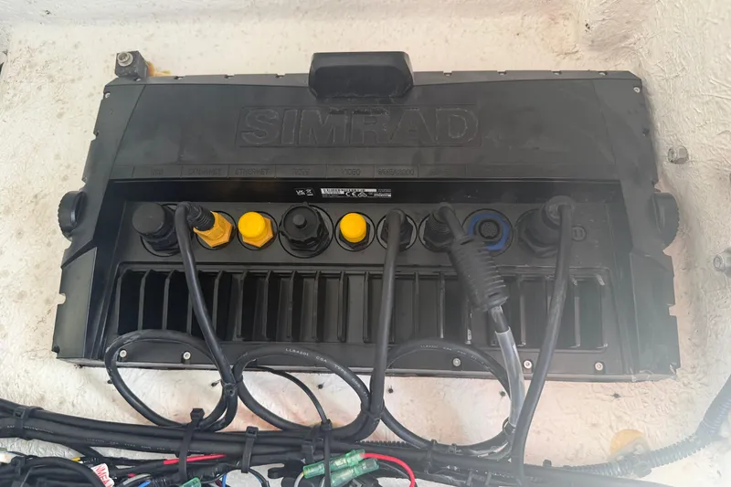 Slide: The Image of Simrad marine electronics system in a 2024 Clearwater 2800 boat, showing various cable connections. - 23