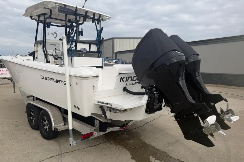 Slide: The Image of 2024 Clearwater 2800 boat with dual outboard motors on a trailer. - 3