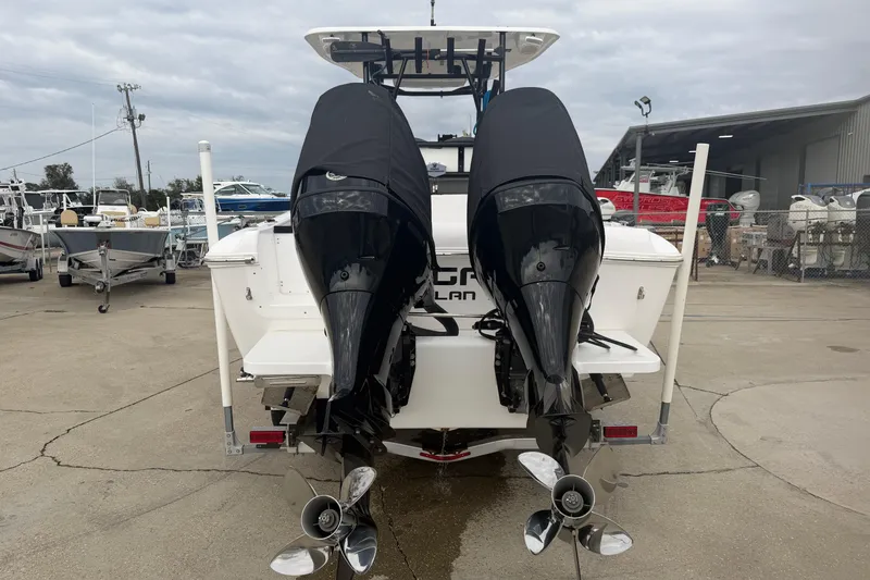 Slide: The Image of 2024 Clearwater 2800 boat with dual outboard engines in a marina setting. - 4