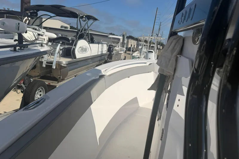 Slide: The Image of 2024 Clearwater 2800 boat interior at a marina with other boats. - 43