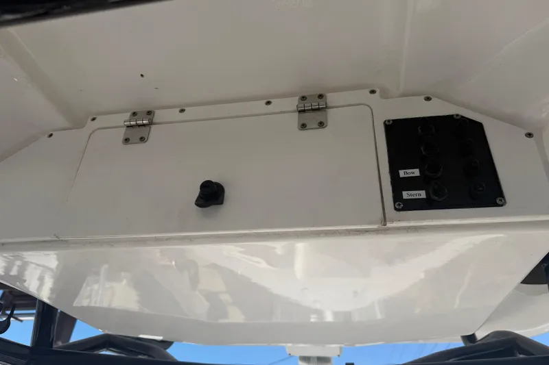 Slide: The Image of 2024 Clearwater 2800 boat control panel with bow and stern switches. - 48