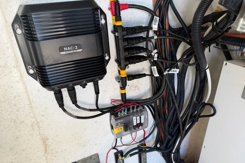 Slide: The Image of Electrical wiring and NAC-2 autopilot computer in Clearwater 2800, 2024 model. - 57