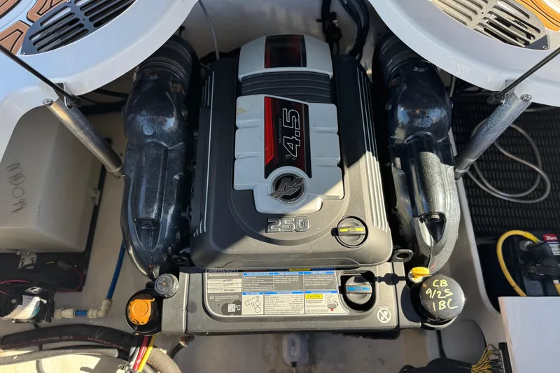 Slide: The Image of Engine compartment of a 2019 Monterey 224FS boat, featuring a 4.5L engine. - 21
