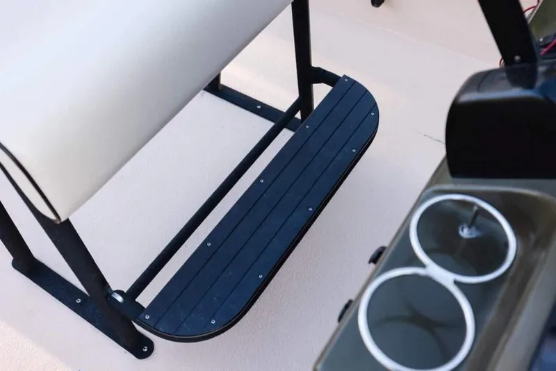 Slide: The Image of Bay Rider 2060 boat interior, featuring a bench seat and cup holders, 2015 model. - 13