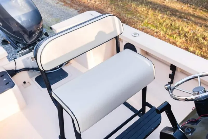 Slide: The Image of Bay Rider 2060 boat interior, 2015 model, featuring steering wheel and seating. - 14