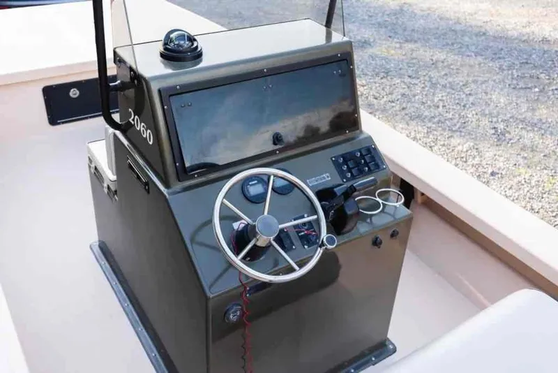 Slide: The Image of 2015 Bay Rider 2060 boat console with steering wheel and control panel. - 15