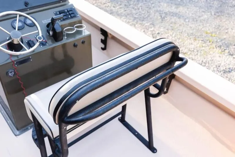 Slide: The Image of 2015 Bay Rider 2060 boat interior with steering console and cushioned seat. - 17