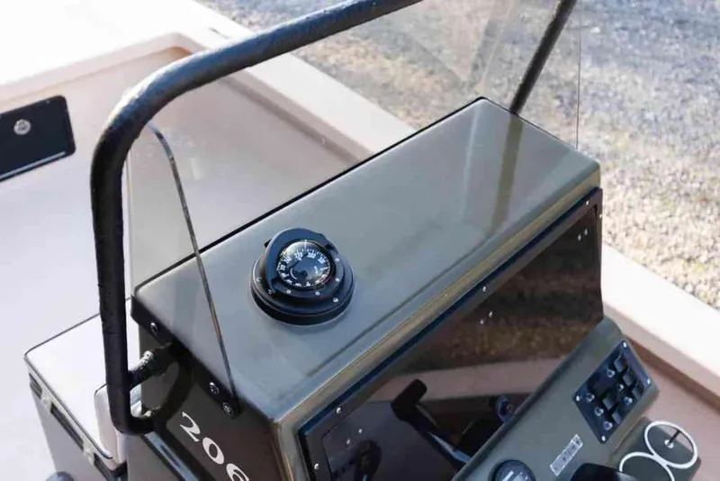 Slide: The Image of 2015 Bay Rider 2060 boat console with compass and controls. - 18