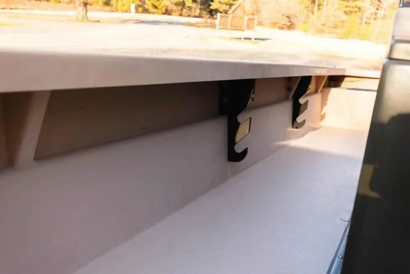 Slide: The Image of Interior view of a 2015 Bay Rider 2060 boat, showcasing storage hooks. - 26