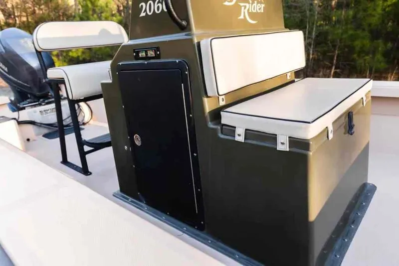 Slide: The Image of 2015 Bay Rider 2060 boat interior with seating and storage compartments. - 30