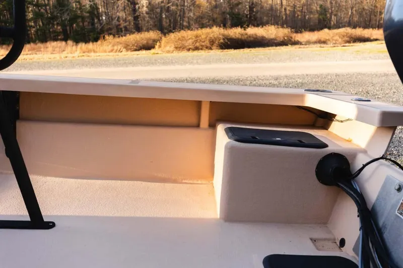 Slide: The Image of 2015 Bay Rider 2060 boat interior with storage compartment and wiring details. - 33