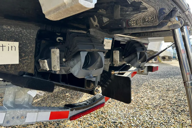 Slide: The Image of 2024 Yamaha Boats 252SE jet propulsion system close-up on gravel surface. - 17