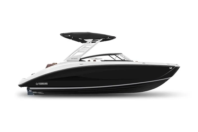 Slide: The Image of 2024 Yamaha Boats 252SE with luxurious seating and sleek design in a marina setting. - 3