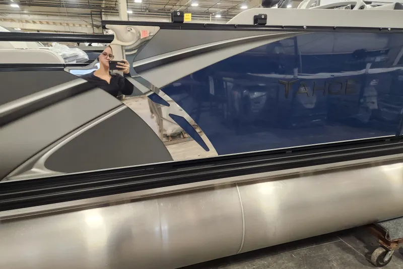 The Image of 2026 Tahoe Pontoon 25E85 LTZ Rear Bench, sleek design, parked outdoors. - 0