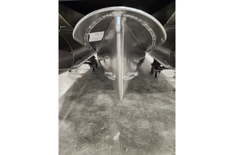 Slide: The Image of 2026 Tahoe Pontoon 25E85 LTZ Rear Bench interior with covered seats and modern dashboard. - 11