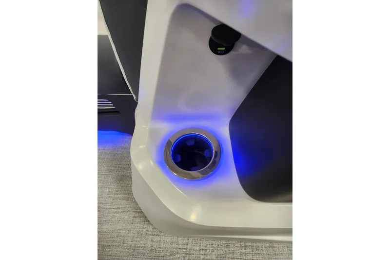 Slide: The Image of Illuminated cup holder in 2026 Tahoe Pontoon 23 LTZ Rear Bench boat interior. - 112