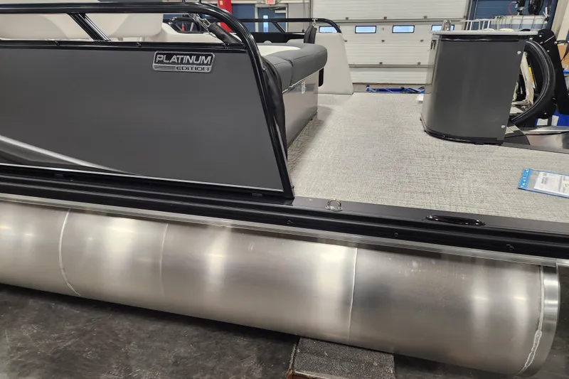 Slide: The Image of 2026 Tahoe Pontoon 23 LTZ Rear Bench, Platinum Edition, interior view in showroom. - 118