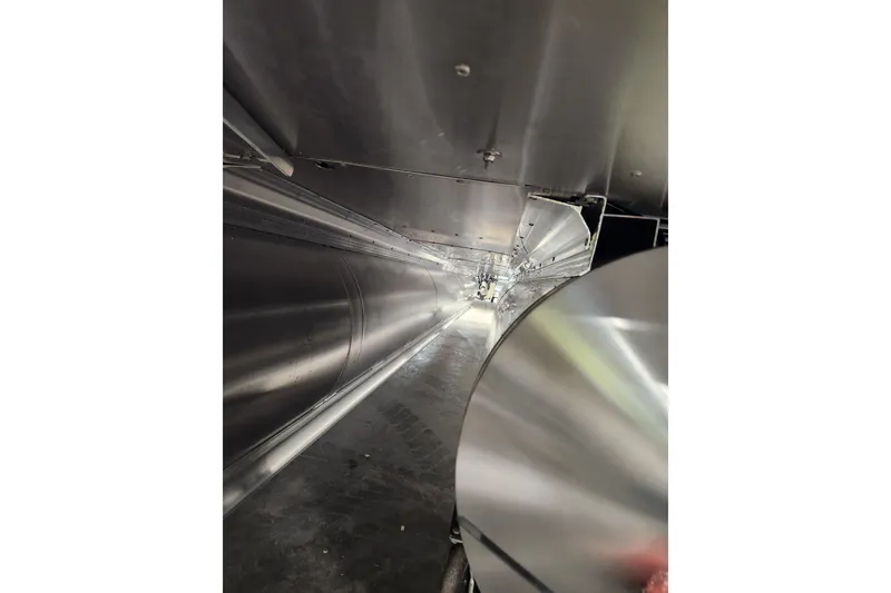 Slide: The Image of 2026 Tahoe Pontoon 25E85 LTZ Rear Bench dashboard with steering wheel and controls. - 12