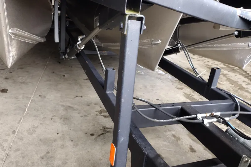 Slide: The Image of 2026 Tahoe Pontoon 25E85 LTZ Rear Bench trailer detail, showcasing sturdy construction. - 122