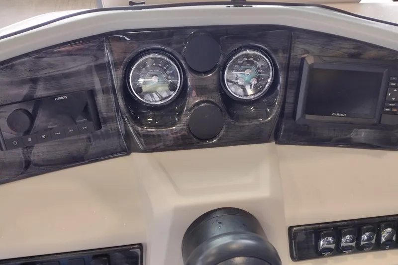 Slide: The Image of Dashboard of 2026 Tahoe Pontoon 25E85 LTZ with gauges and Garmin display. - 136