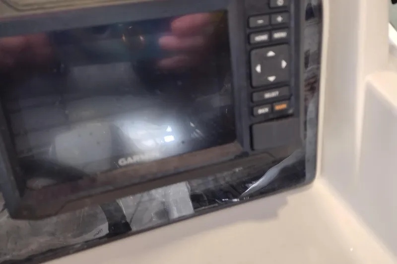 Slide: The Image of Control panel of 2026 Tahoe Pontoon 25E85 LTZ Rear Bench with Garmin display. - 138