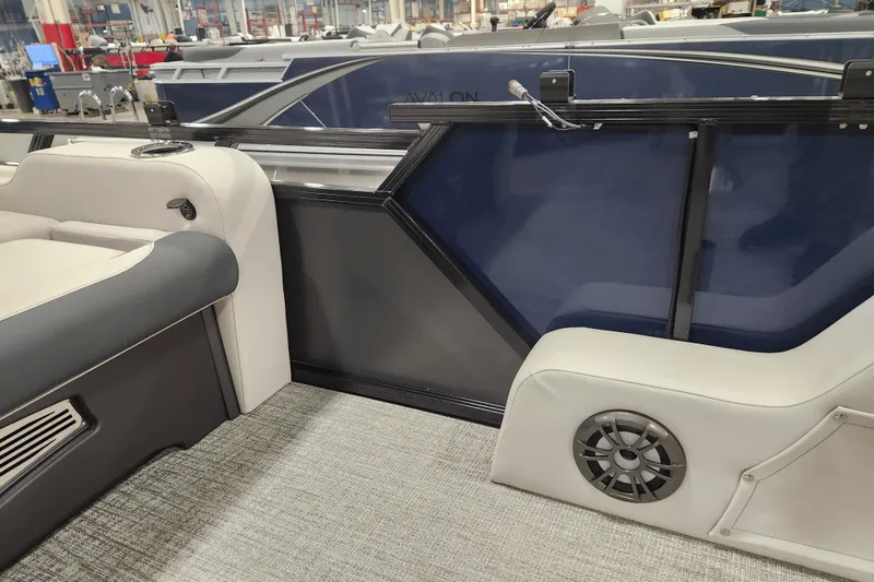 Slide: The Image of 2026 Tahoe Pontoon 25E85 LTZ Rear Bench with plastic-covered seats, steering wheel, and modern interior. - 14