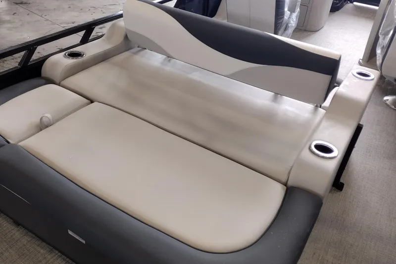 Slide: The Image of 2026 Tahoe Pontoon 25E85 LTZ Rear Bench with cup holders, beige and gray upholstery. - 141