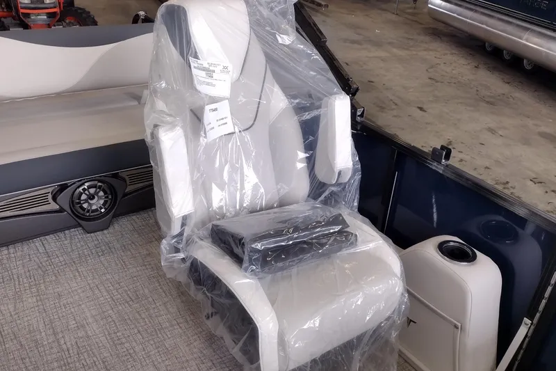 Slide: The Image of 2026 Tahoe Pontoon 25E85 LTZ Rear Bench seat wrapped in protective plastic. - 146