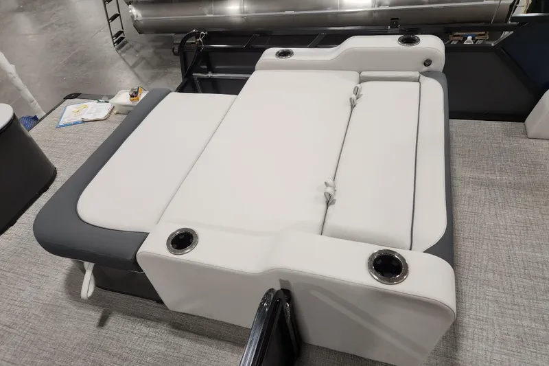Slide: The Image of 2026 Tahoe Pontoon 25E85 LTZ Rear Bench interior with cup holders and sleek design. - 18