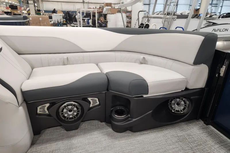 Slide: The Image of 2026 Tahoe Pontoon 25E85 LTZ Rear Bench with sleek gray and white upholstery. - 21