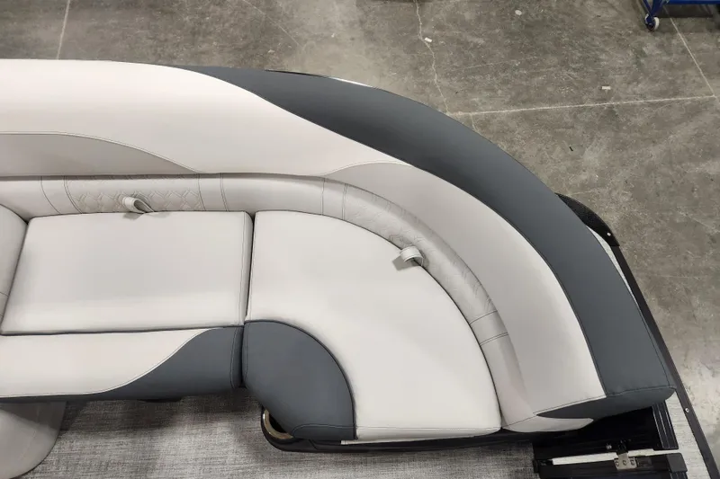 Slide: The Image of Open storage compartment on 2026 Tahoe Pontoon 25E85 LTZ Rear Bench. - 29