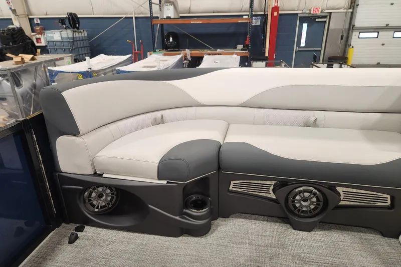 Slide: The Image of 2026 Tahoe Pontoon 25E85 LTZ Rear Bench with modern speaker and cup holder design. - 31