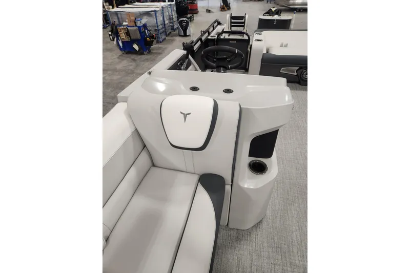 Slide: The Image of 2026 Tahoe Pontoon 25E85 LTZ Rear Bench with luxurious seating in a snowy setting. - 33
