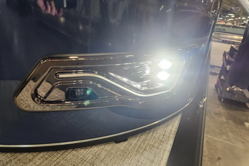 Slide: The Image of 2026 Tahoe Pontoon 25E85 LTZ Rear Bench in a showroom, showcasing sleek design. - 42