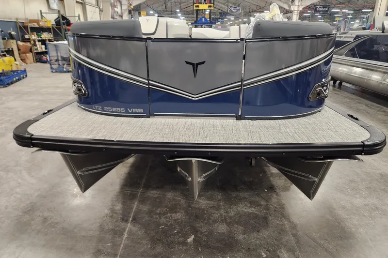 Slide: The Image of 2026 Tahoe Pontoon 25E85 LTZ Rear Bench on snowy driveway, featuring sleek design and powerful motor. - 5