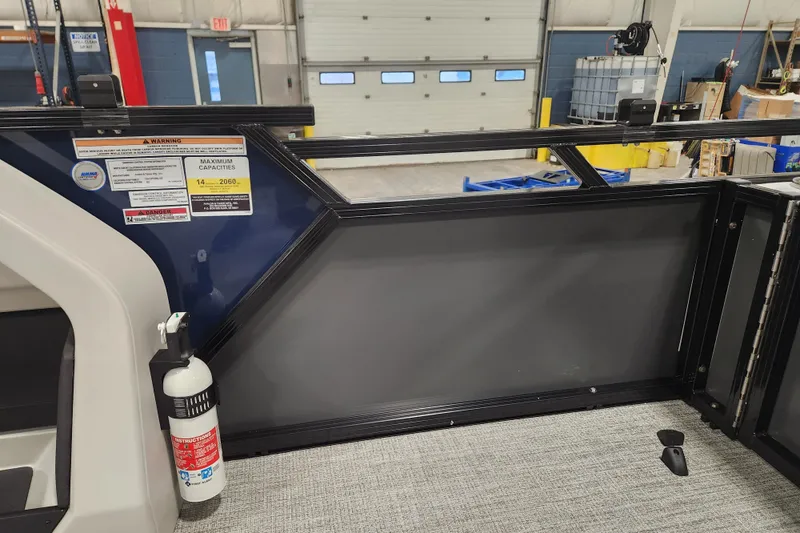 Slide: The Image of 2026 Tahoe Pontoon 23 LTZ Rear Bench in a showroom, showcasing sleek design and modern features. - 51