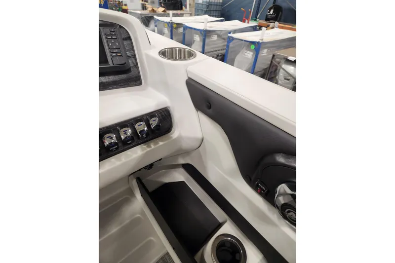 Slide: The Image of 2026 Tahoe Pontoon 25E85 LTZ Rear Bench dashboard with steering wheel and controls. - 52