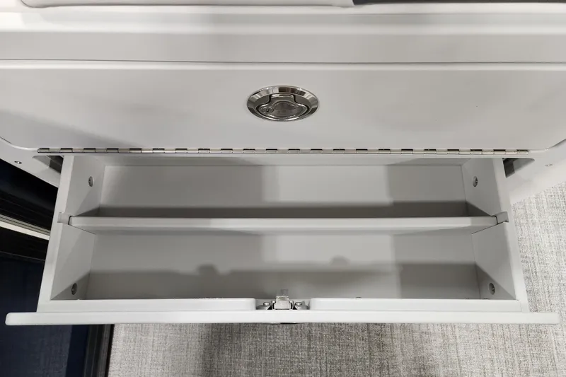 Slide: The Image of 2026 Tahoe Pontoon 23 LTZ Rear Bench interior with seating and speaker detail. - 59