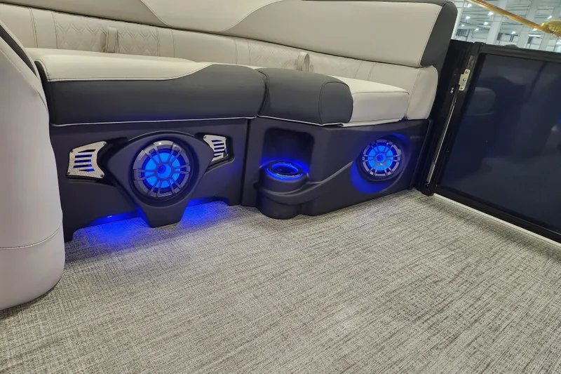 Slide: The Image of 2026 Tahoe Pontoon 23 LTZ Rear Bench with speaker and cup holder detail. - 60