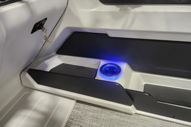 Slide: The Image of 2026 Tahoe Pontoon 23 LTZ Rear Bench with storage drawers in a showroom. - 61