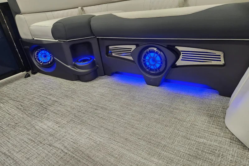 Slide: The Image of 2026 Tahoe Pontoon 23 LTZ Rear Bench gate with warning sign in a workshop setting. - 62